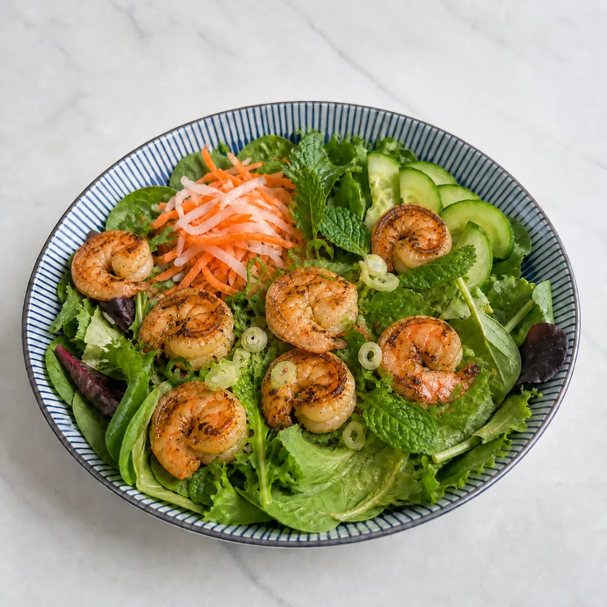 Salad bowl with garlic shrimp